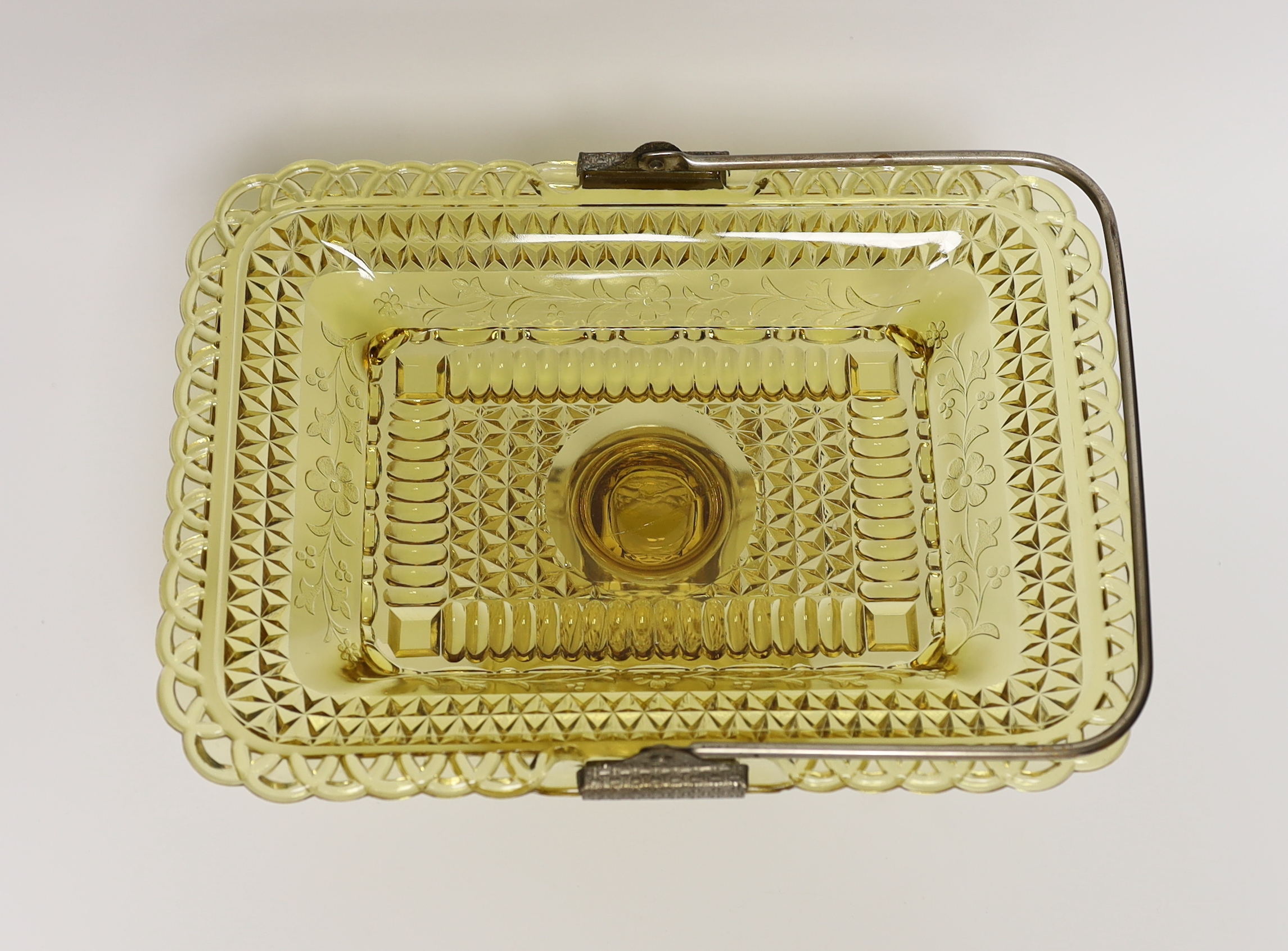 An American amber pressed glass comport/basket with swing handle, probably Pittsburg, 27cm wide